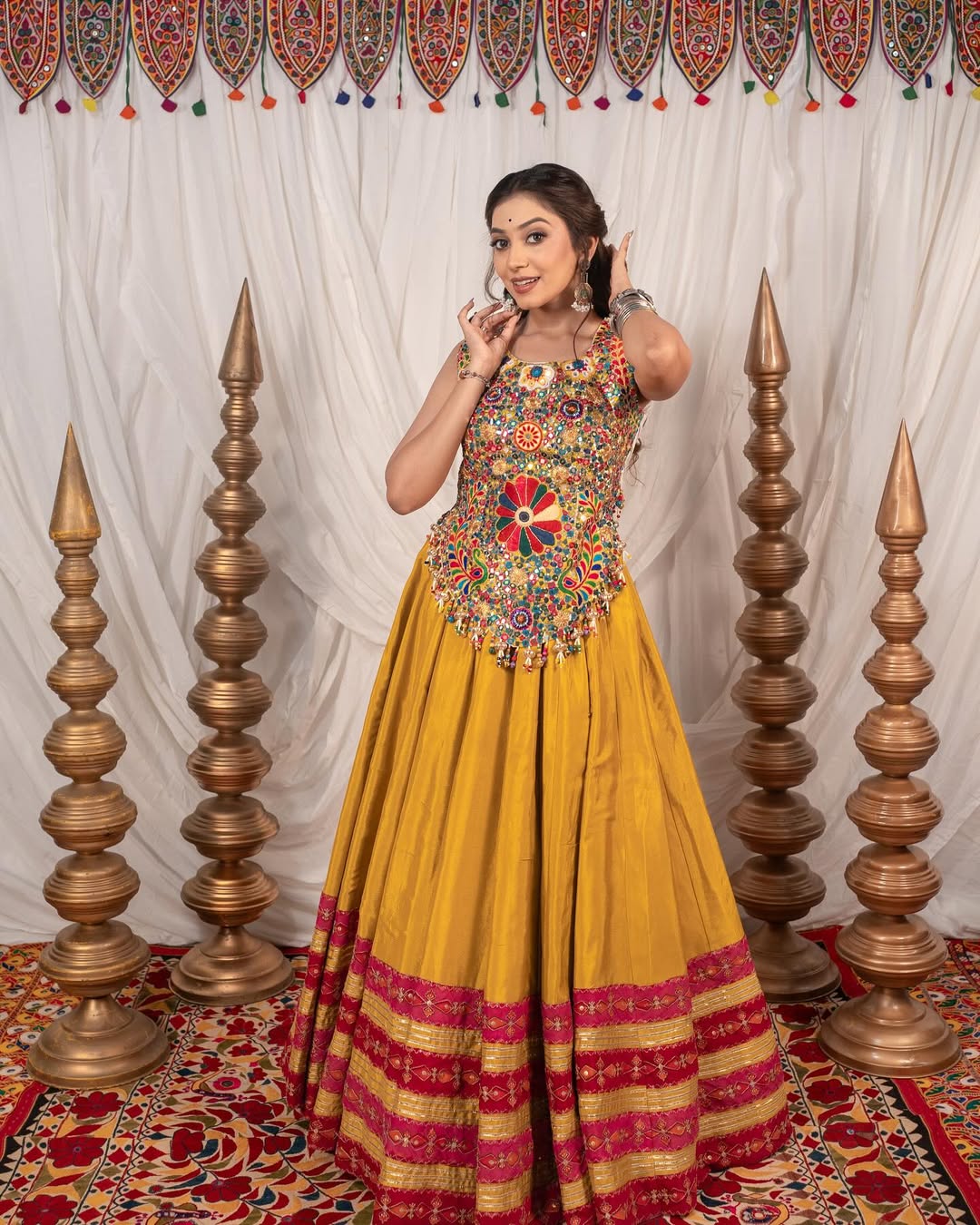 Yellow Chaniya With Grand 10-Meter Flair Paired With Detailed Kachhi Work Blouse.