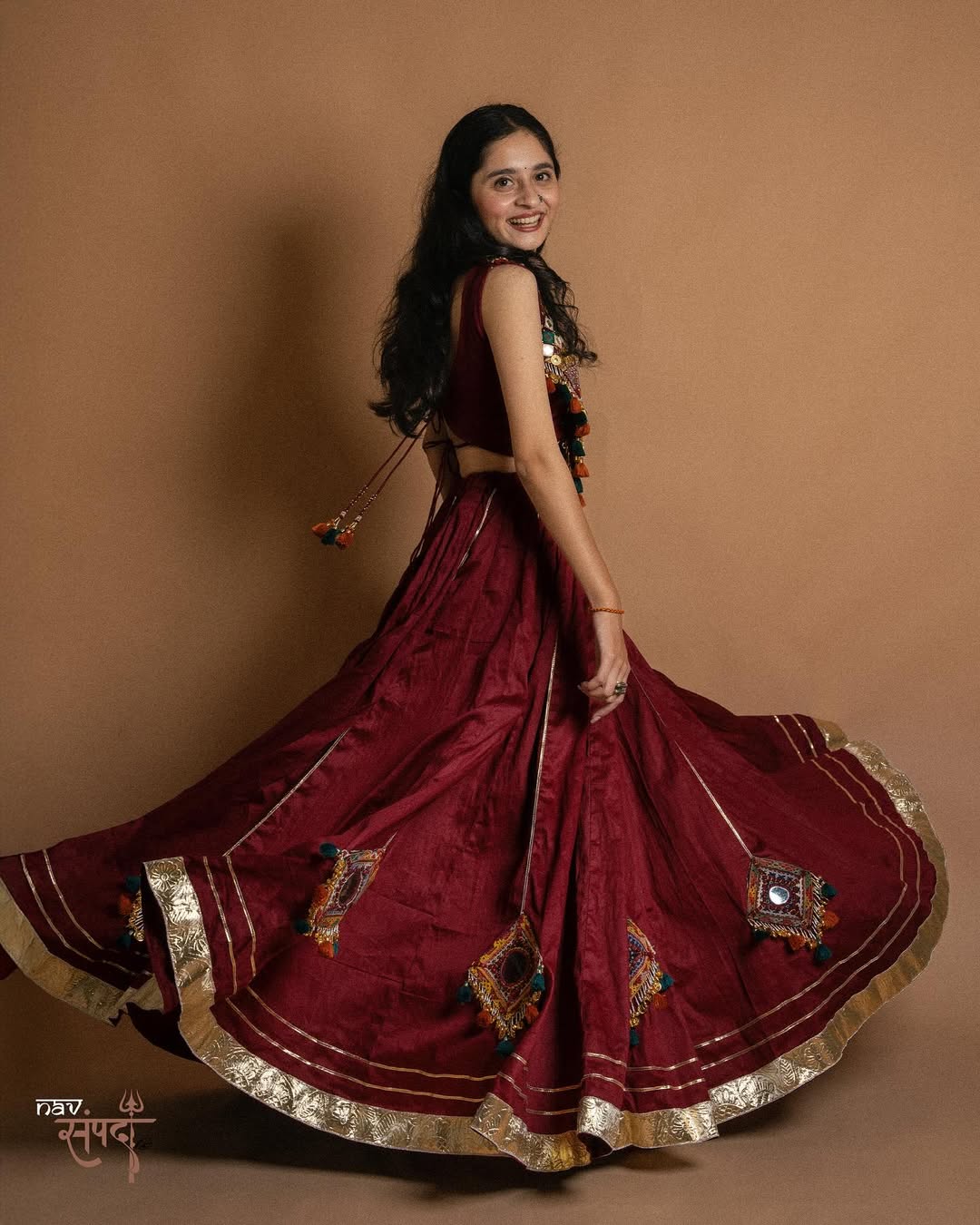 kutchi mirror work blouse and stunning maroon flared Lahenga
