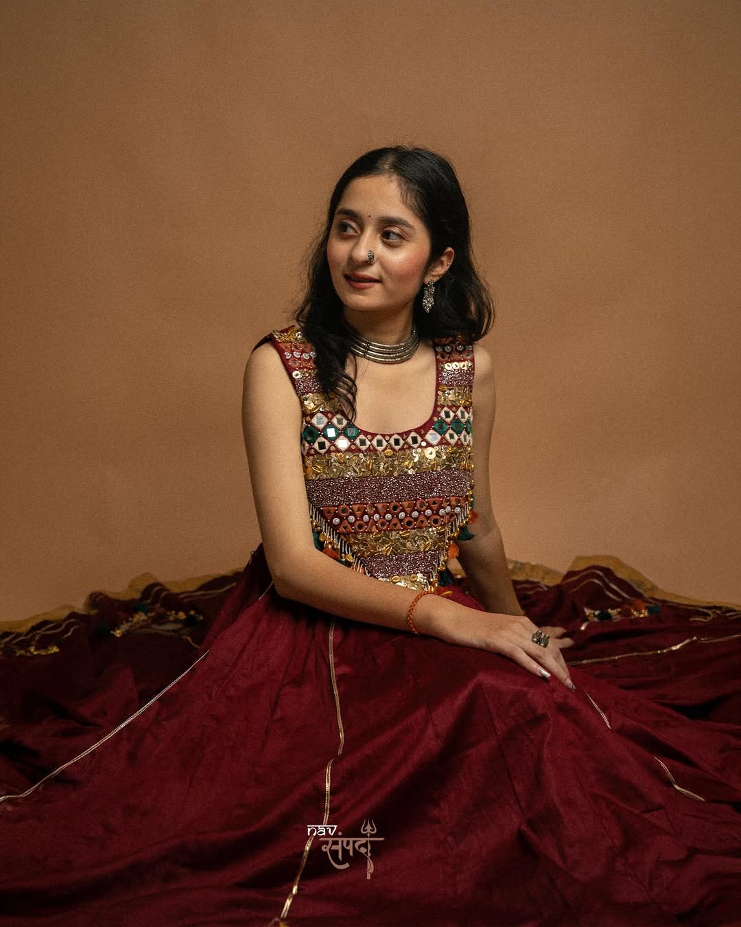 kutchi mirror work blouse and stunning maroon flared Lahenga
