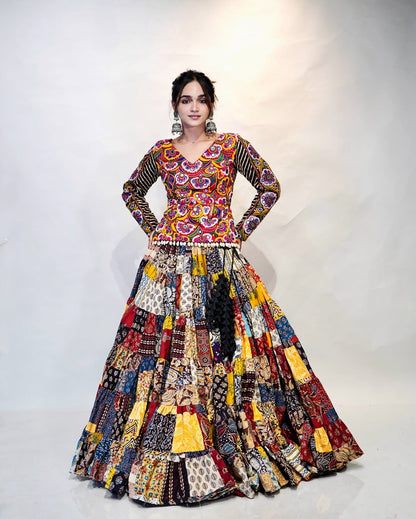 Multicolour Mix Fabric Chaniya With Grand 8-Meter Flair Paired With Detailed Kachhi Work Blouse.