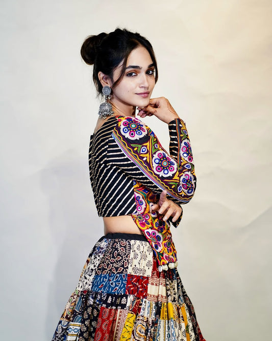 Multicolour Mix Fabric Chaniya With Grand 8-Meter Flair Paired With Detailed Kachhi Work Blouse.