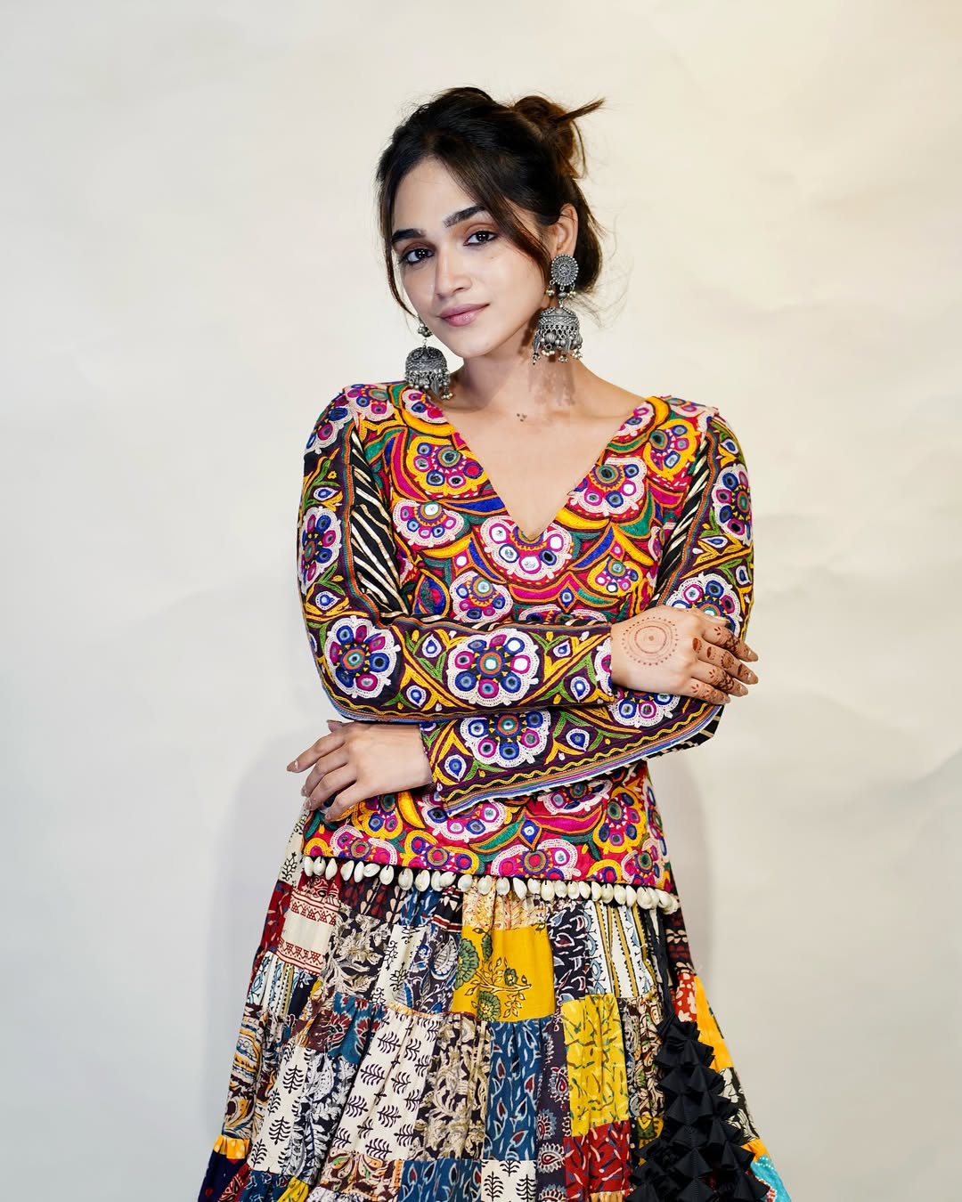 Multicolour Mix Fabric Chaniya With Grand 8-Meter Flair Paired With Detailed Kachhi Work Blouse.