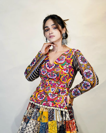 Multicolour Mix Fabric Chaniya With Grand 8-Meter Flair Paired With Detailed Kachhi Work Blouse.