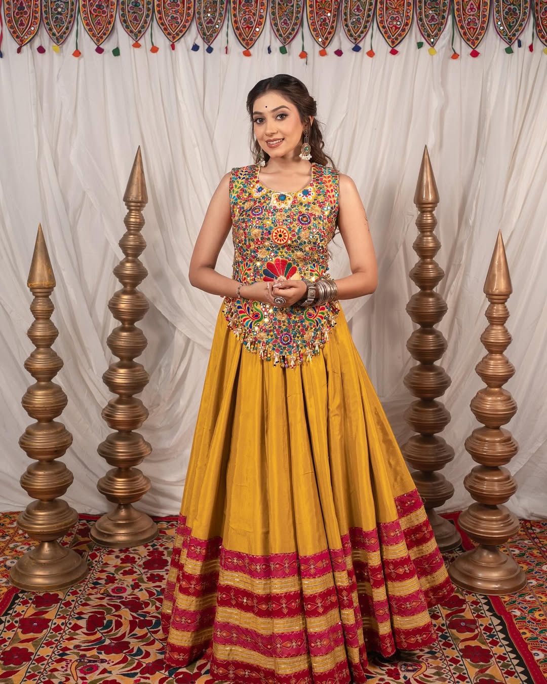 Yellow Chaniya With Grand 10-Meter Flair Paired With Detailed Kachhi Work Blouse.