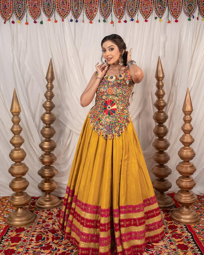 Yellow Chaniya With Grand 10-Meter Flair Paired With Detailed Kachhi Work Blouse.