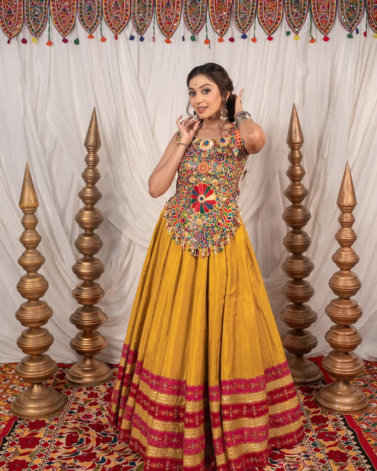Yellow Chaniya With Grand 10-Meter Flair Paired With Detailed Kachhi Work Blouse.