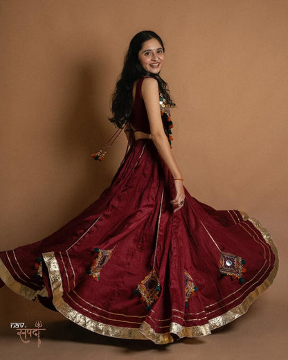 kutchi mirror work blouse and stunning maroon flared Lahenga