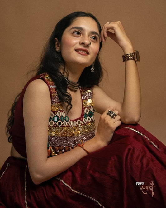 kutchi mirror work blouse and stunning maroon flared Lahenga