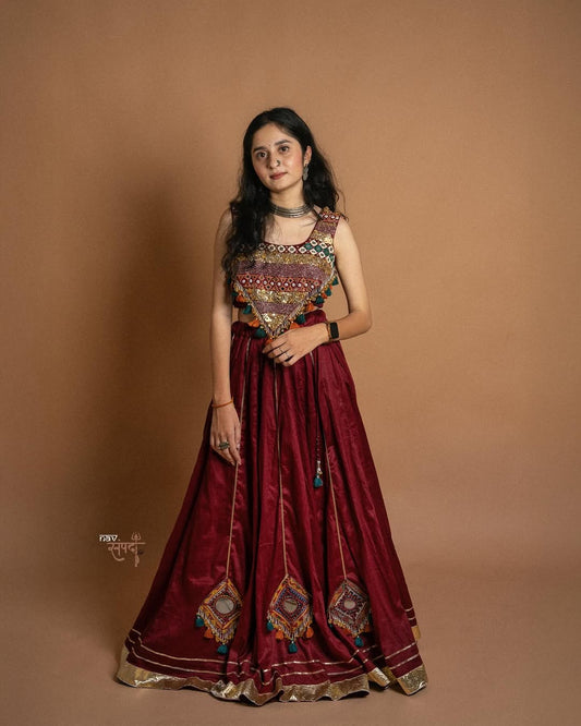 kutchi mirror work blouse and stunning maroon flared Lahenga