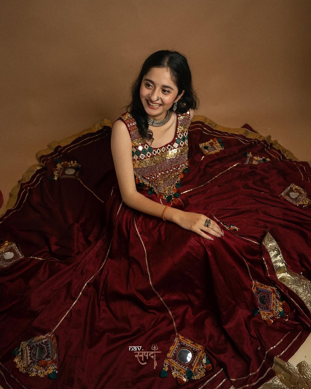 kutchi mirror work blouse and stunning maroon flared Lahenga