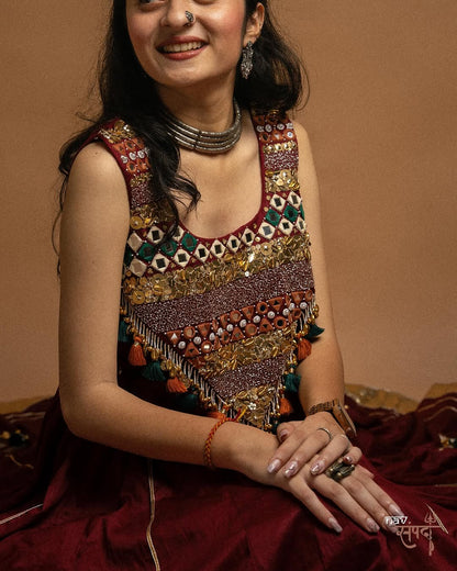 kutchi mirror work blouse and stunning maroon flared Lahenga