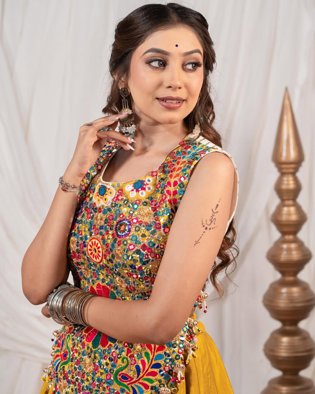 Yellow Chaniya With Grand 10-Meter Flair Paired With Detailed Kachhi Work Blouse.