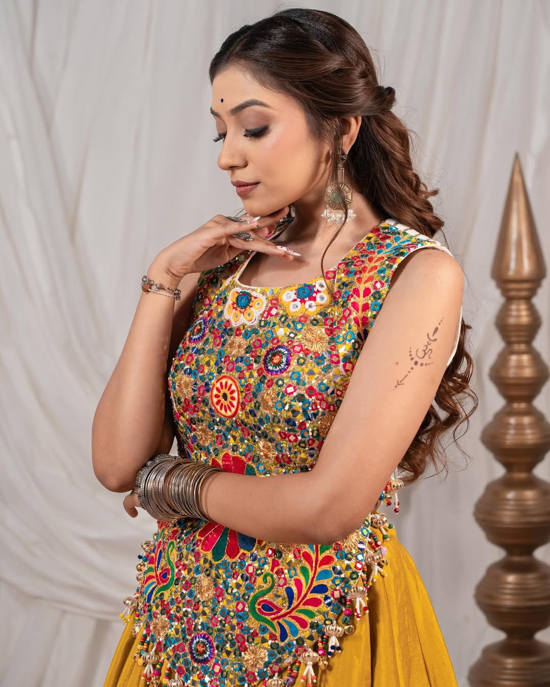Yellow Chaniya With Grand 10-Meter Flair Paired With Detailed Kachhi Work Blouse.