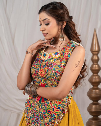 Yellow Chaniya With Grand 10-Meter Flair Paired With Detailed Kachhi Work Blouse.