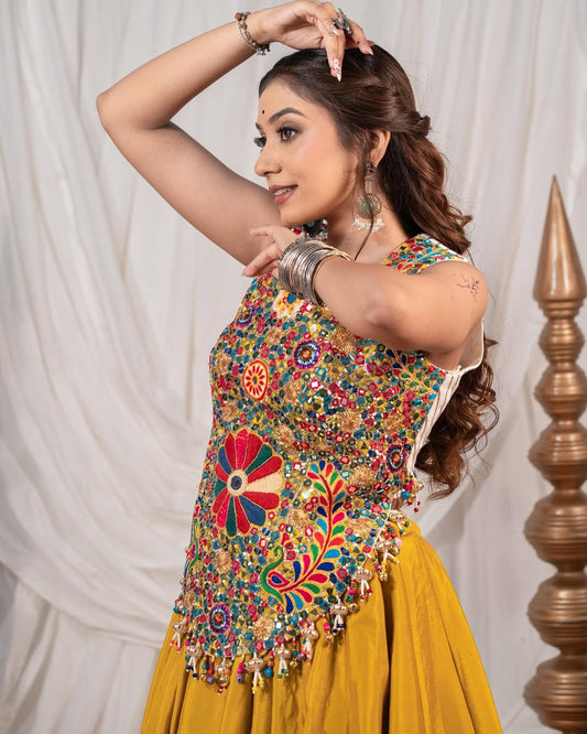 Yellow Chaniya With Grand 10-Meter Flair Paired With Detailed Kachhi Work Blouse.